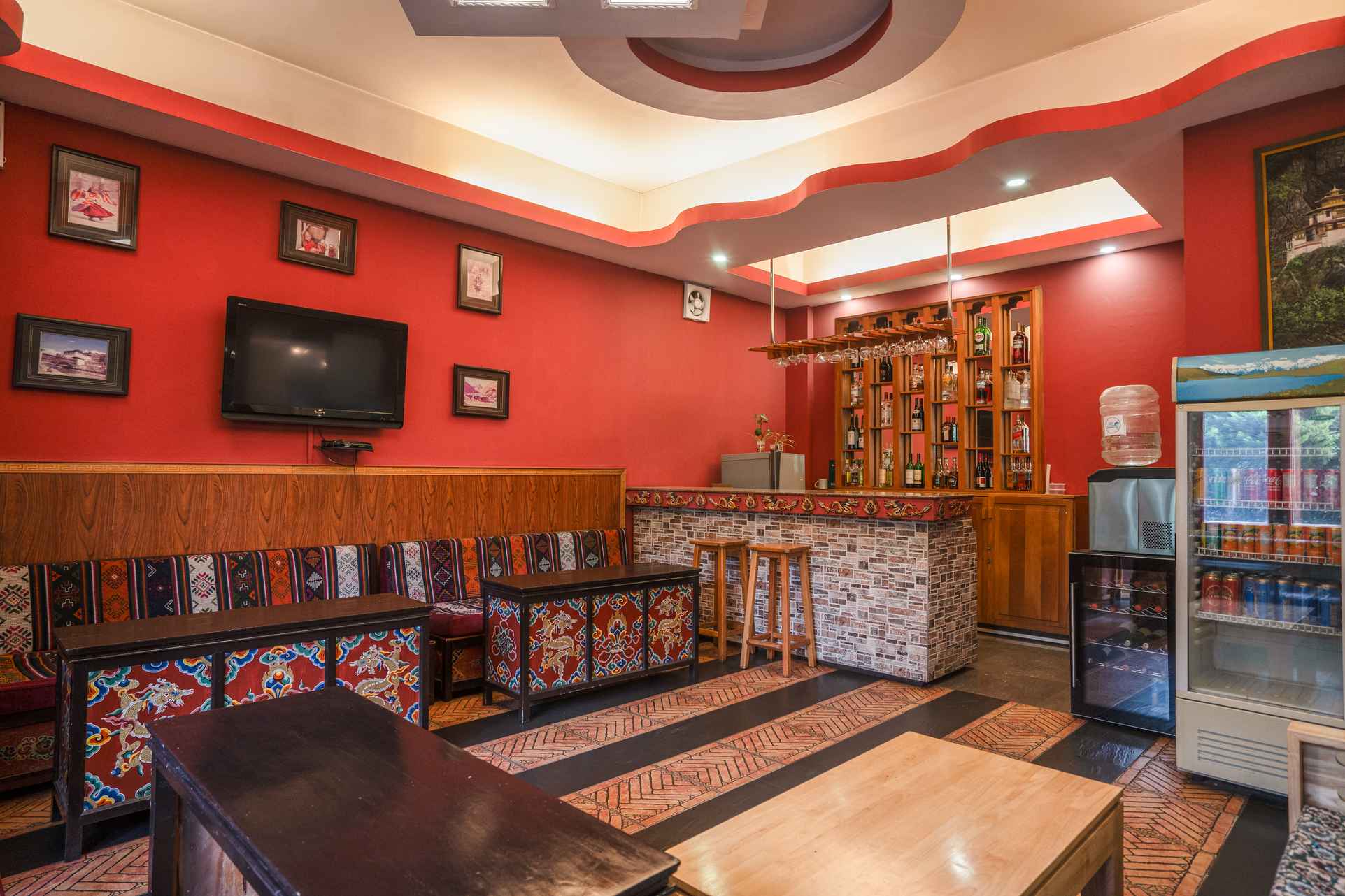 Bar interior with warm lighting at Hotel Migmar